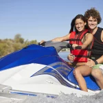 happy-caucasian-couple-riding-jet-ski-on-lake-1536×1025