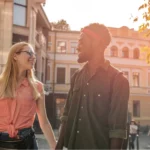 a-man-and-a-woman-walk-down-the-street-holding-hands-1536×1025