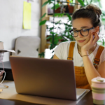 a-woman-tied-her-hair-in-a-ponytail-sitting-behind-a-laptop-1536×1025